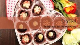  Presentation with heart flowers - Presentation enhanced with heart shaped box with candies and flowers on a wooden background close up background and a red colored foreground
