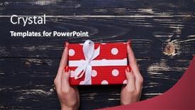  Presentation with manicure - Slides enhanced with high angle of little dotted gift box keeping by female hands female hands with perfect red manicure holding present box over shabby wooden background background and a dark gray colored foreground