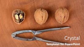  Presentation with nut - Cool new presentation design with high angle shot of three walnuts and a nutcracker on a wood surface one nut is cracked in half horizontal format backdrop and a red colored foreground