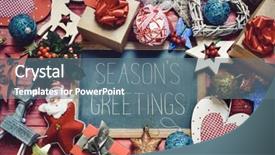  Presentation with red seasons greetings - Cool new presentation with high-angle shot of a chalkboard with the text seasons greetings surrounded by cozy christmas ornaments such as a wooden reindeer some baubles or some gifts placed on a red rustic wooden surface backdrop and a ocean colored foreground