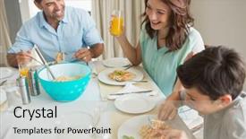  Presentation with dining table - Beautiful slide deck featuring high angle view of family of three sitting at dining table in the home backdrop and a soft green colored foreground