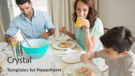  Presentation with dining table - Presentation featuring high angle view of family of three sitting at dining table in the home background and a soft green colored foreground