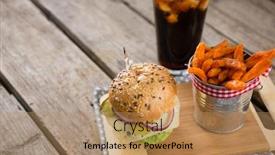  Presentation with burger fries - Slide deck featuring high angle view of french fries in container by burger on cutting board with drink at table background and a coral colored foreground
