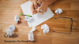  Presentation with crushing - Theme having high angle view of man crushing paper while sitting at desk in office background and a coral colored foreground