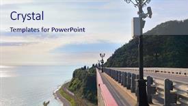  Presentation with sea shore - Audience pleasing presentation theme consisting of highway and railway lanters mountain backdrop and a sky blue colored foreground