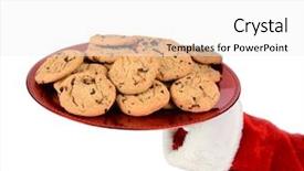  Presentation with santa - Audience pleasing PPT theme consisting of holding a tray of cookies backdrop and a white colored foreground