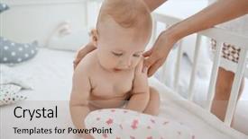  Presentation with mother baby - PPT theme having holding little baby in crib background and a coral colored foreground