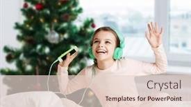  Presentation with christmas music - Slide set with holidays children and technology concept - happy smiling girl in headphones sitting on bed with smartphone and listening to music over christmas tree background background and a lemonade colored foreground