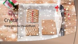  Presentation with christmas baking - Theme with holidays christmas baking and sweets concept - closeup of gingerbread house details on pan background and a coral colored foreground