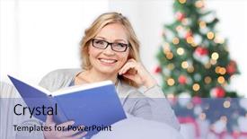  Presentation with literature - Audience pleasing theme consisting of holidays leisure literature and people concept - smiling middle aged woman reading book and sitting on couch at home over christmas tree lights background backdrop and a light blue colored foreground