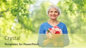  Presentation with old age - Theme having holidays old age and people concept - happy smiling senior woman with flowers over green natural background background and a blonde colored foreground