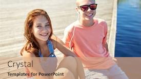  Presentation with love music - Presentation theme enhanced with holidays vacation love and people concept - happy teenage couple with earphones sitting on river berth and listening to music at summer background and a coral colored foreground