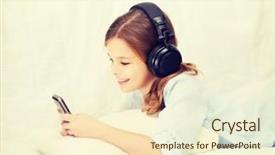  Presentation with new technology - Presentation having home leisure new technology and music concept - smiling little girl with smartphone and headphones at home background and a cream colored foreground