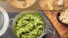  Presentation with leaves flat lay - Beautiful presentation theme featuring homemade-pesto-sauce-with-basil backdrop and a yellow colored foreground