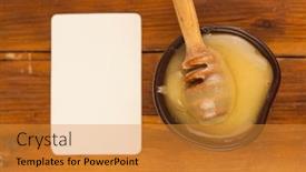  Presentation with honey - Amazing PPT theme having honey-dripping-from-honey-dipper backdrop and a gold colored foreground