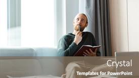  Presentation with writing notes - Cool new presentation theme with image of a concentrated young bearded man sitting in home writing notes backdrop and a violet colored foreground