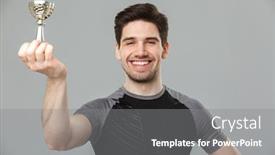  Presentation with award - PPT theme with image of happy young sportsman standing isolated over grey wall background holding award background and a gray colored foreground