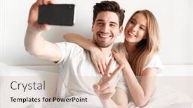  Presentation with peace - PPT theme enhanced with image of young cheerful loving couple lies in bed take a selfie by smartphone looking aside showing peace gesture background and a soft green colored foreground