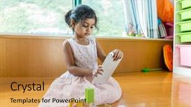  Presentation with play - Cool new PPT theme with indian games - little girl play digital tablet backdrop and a gold colored foreground