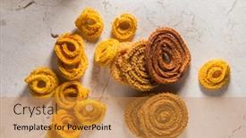  Presentation with traditional indian drink masala chai - Theme enhanced with indian traditional snack or savory- chaklee or murukku scattered on marble background various types of deep fried chaklees are made during special occasions in india background and a gold colored foreground