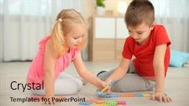  Presentation with two cute sisters playing - PPT theme having little children playing with pazzle background and a  colored foreground