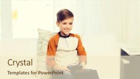  Presentation with technology and children - Amazing PPT theme having concept - smiling boy with joystick backdrop and a cream colored foreground