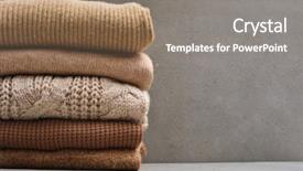  Presentation with knitted clothes - Presentation featuring jumper cables - stacked of knitted winter clothes background and a gray colored foreground