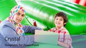  Presentation with fashion show - PPT theme consisting of kids fashion show - mother and her son laptop background and a teal colored foreground