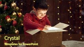  Presentation with child tree - Cool new presentation with child boy sitting with gift box near christmas decorated fir tree dark wooden background backdrop and a tawny brown colored foreground