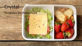  Presentation with lunch box - PPT layouts with kids healthy habits - lunch box with food background and a coral colored foreground