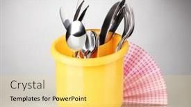  Presentation with knives - Beautiful presentation featuring kitchen cutlery knives forks and spoons in yellow stand with pink napkin on grey background backdrop and a yellow colored foreground