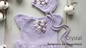  Presentation with knitted clothes - Slide set having knitted-newborn-baby-clothes-composed background and a light blue colored foreground