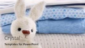  Presentation with knitted clothes - Colorful slide deck enhanced with knitted toy bunny and baby clothes closeup backdrop and a soft green colored foreground