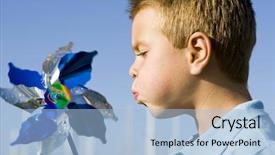  Presentation with pinwheel - Theme having les energie eolienne - little boy blowing background and a light blue colored foreground