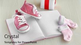  Presentation with baby shoes - Beautiful presentation featuring little baby shoes with notebook backdrop and a light gray colored foreground