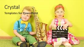  Presentation with trumpet - Audience pleasing presentation consisting of little boy and girl sitting at a bright green wall with a trumpet and a clapstick backdrop and a yellow colored foreground