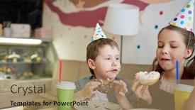 Presentation with birthday boy - PPT theme consisting of little boy and girl in birthday-caps eating tasty donuts in cafeteria background and a coral colored foreground