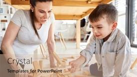  Presentation with wooden building blocks - PPT theme consisting of little-boy-plays-with-building background and a coral colored foreground