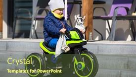  Presentation with motorcycle electric - Amazing PPT theme having little-boy-riding-an-electric backdrop and a tawny brown colored foreground