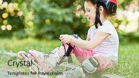  Presentation with knee - PPT layouts with little girl in protective equipment and rollers sits on curb of walkway in park fastening knee-pad background and a mint green colored foreground
