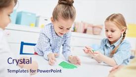  Presentation with kindergarten - PPT theme consisting of little girls playing with green background and a sky blue colored foreground
