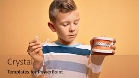  Presentation with orthodontic - PPT theme enhanced with little-kid-boy-holding-professional background and a coral colored foreground