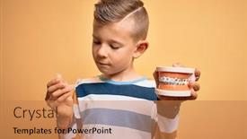  Presentation with orthodontic - Colorful PPT theme enhanced with little-kid-boy-holding-professional backdrop and a coral colored foreground