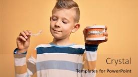  Presentation with orthodontic - Amazing presentation theme having little-kid-boy-holding-professional backdrop and a coral colored foreground