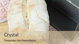  Presentation with vertical - Presentation theme enhanced with loaf of english split-tin bread fresh from the oven on a wooden board with the baking tin and oven gloves vertical orientation background and a soft green colored foreground