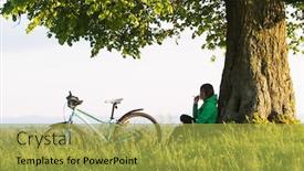  Presentation with green city - Presentation theme with lonely-girl-sits-under background and a yellow colored foreground