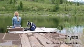  Presentation with lonely - Presentation theme having lonely girl sitting near the lake background and a coral colored foreground