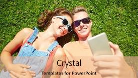  Presentation with teenage love - Theme with love and people concept - happy teenage couple in sunglasses lying on grass and taking selfie on smartphone at summer background and a lemonade colored foreground