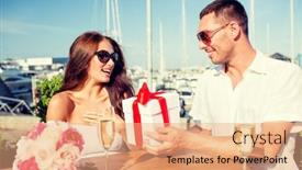  Presentation with dating - Theme having love dating people and holidays concept - smiling couple wearing sunglasses sitting with gift box flowers and champagne at cafe background and a coral colored foreground