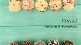  Presentation with confectionery tasty cake pops - Audience pleasing presentation consisting of love pink - tasty cake pops on wooden backdrop and a  colored foreground